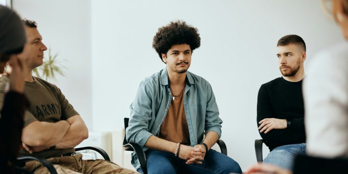 young-muslim-man-attending-group-therapy-at-mental-health-center-